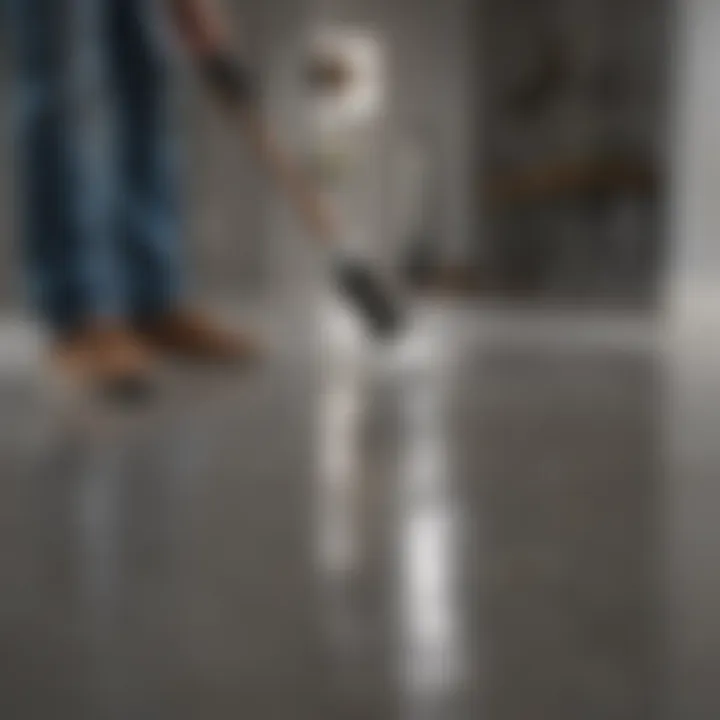 A professional applying a concrete sealer with precision to ensure even coverage