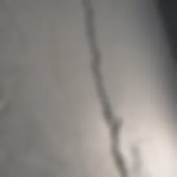 Detailed view of a drywall seam crack before repair