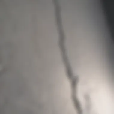 Detailed view of a drywall seam crack before repair
