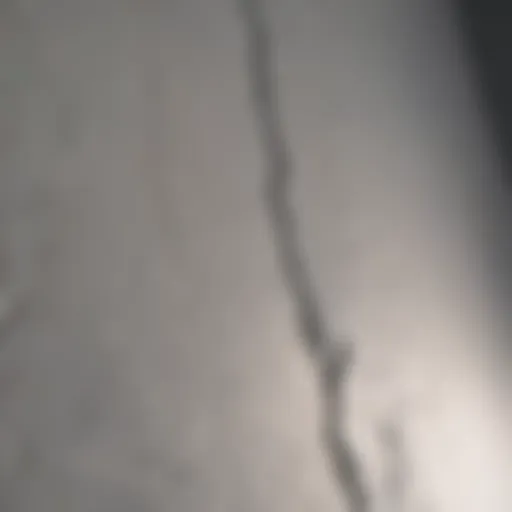 Detailed view of a drywall seam crack before repair