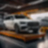 Luxury car being loaded onto enclosed transport vehicle