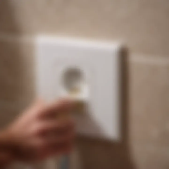 Professional installing electrical outlet in bathroom