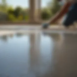 Concrete patio floor being prepped with etching solution