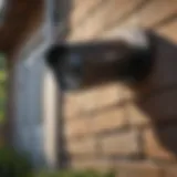 A sleek outdoor security camera mounted on a home exterior, showcasing its design and functionality.