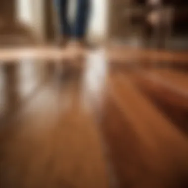 Precision Hardwood Floor Refinishing Close-up of skilled craftsman refinishing hardwood floor without showing faces