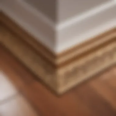 Skilled artisan crafting intricate baseboard corners