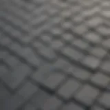 Close-up view of gray roof sealant application on shingles