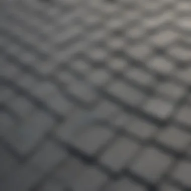 Close-up view of gray roof sealant application on shingles