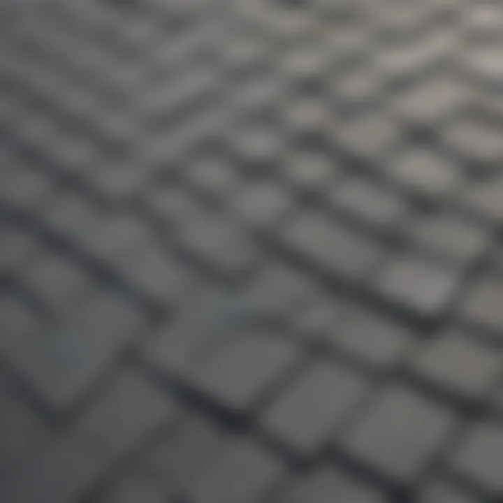Close-up view of gray roof sealant application on shingles